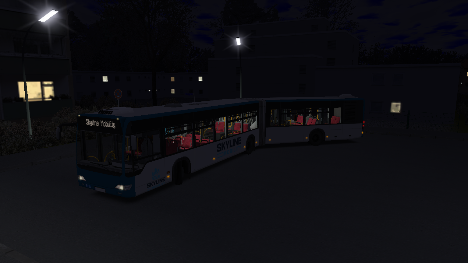 Skyline Mobility Gelenkbus bei Nacht im Wohngebiet